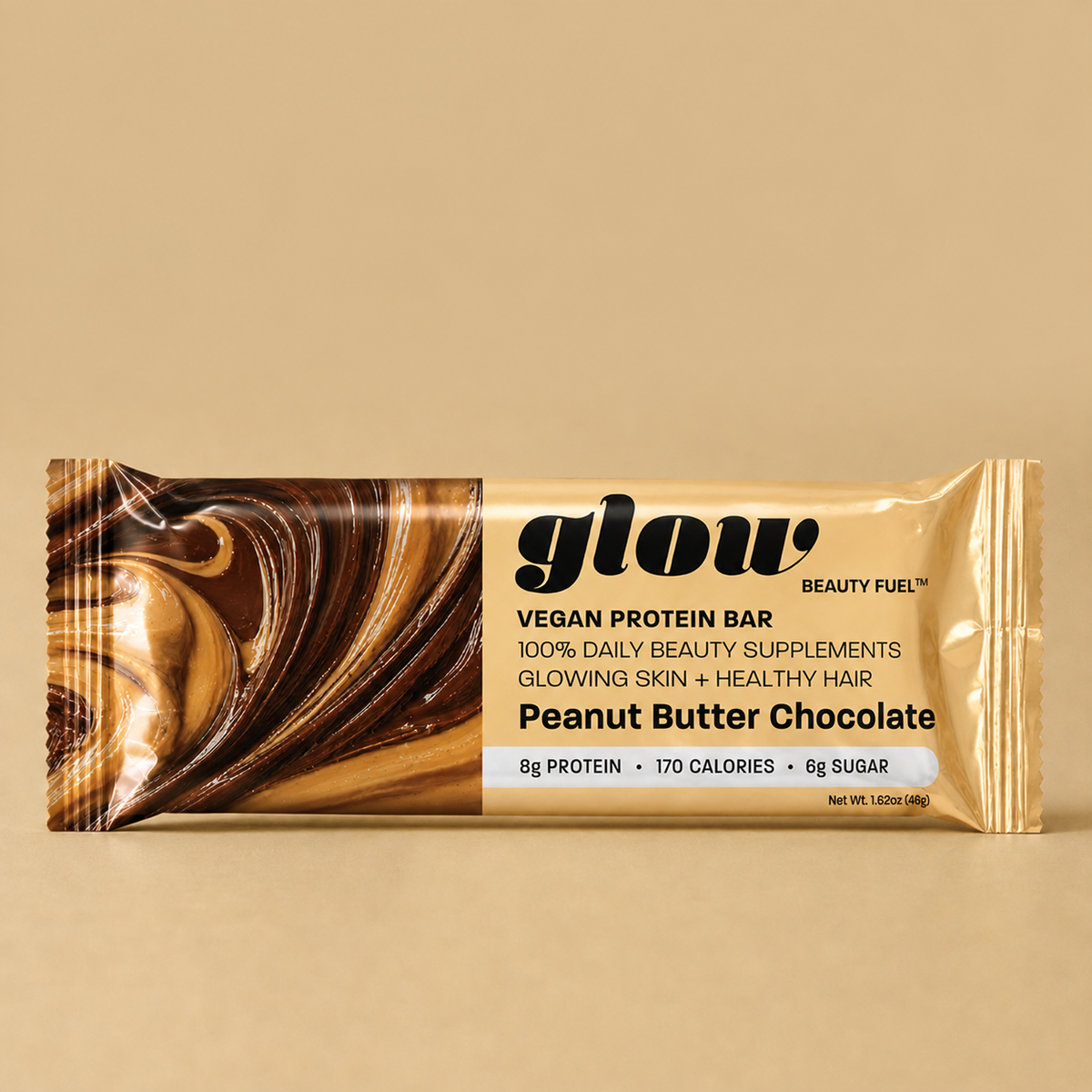 A wrapped protein bar package labeled 'glow' and 'Peanut Butter Chocolate' on a warm beige background. The wrapper is metallic gold with a dark brown chocolate swirl graphic on the left and product text on the right.
