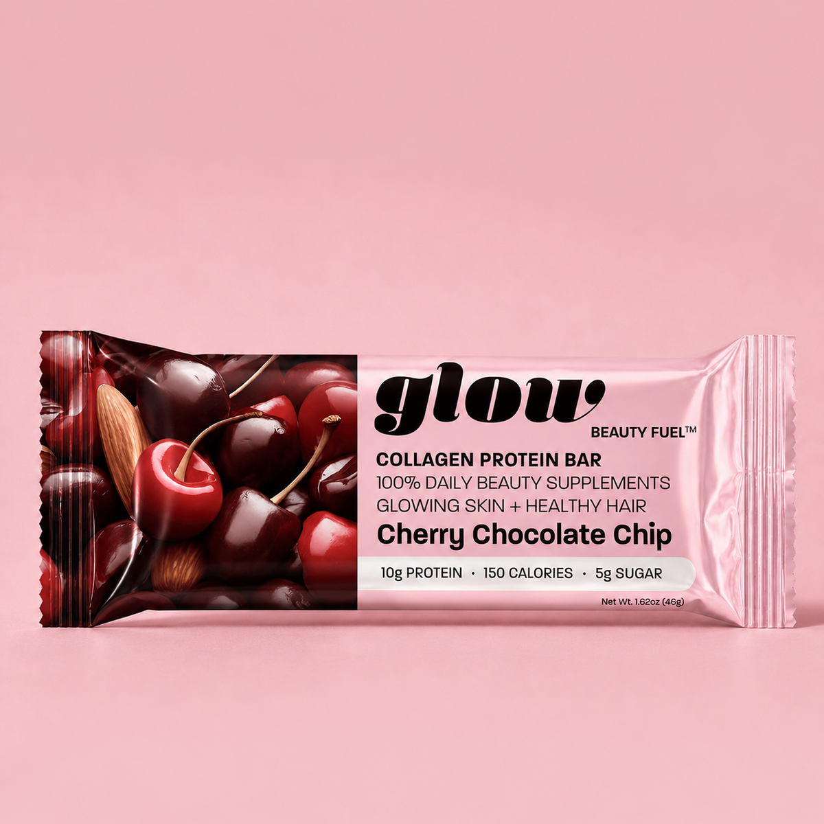 A packaged collagen protein bar in a pink wrapper with cherry and almond imagery, labeled 'glow BEAUTY FUEL' and 'Cherry Chocolate Chip,' on a solid pink background.
