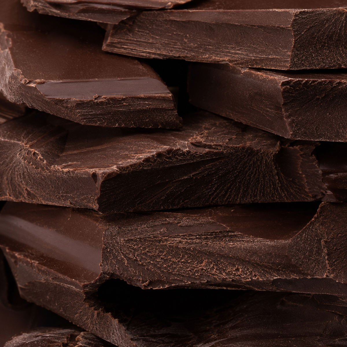 Close-up of stacked chocolate bars with a dark brown color.